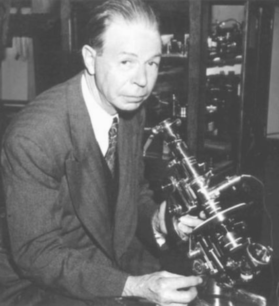 Dr. Royal Raymond Rife at a Leitz petrographic microscope
